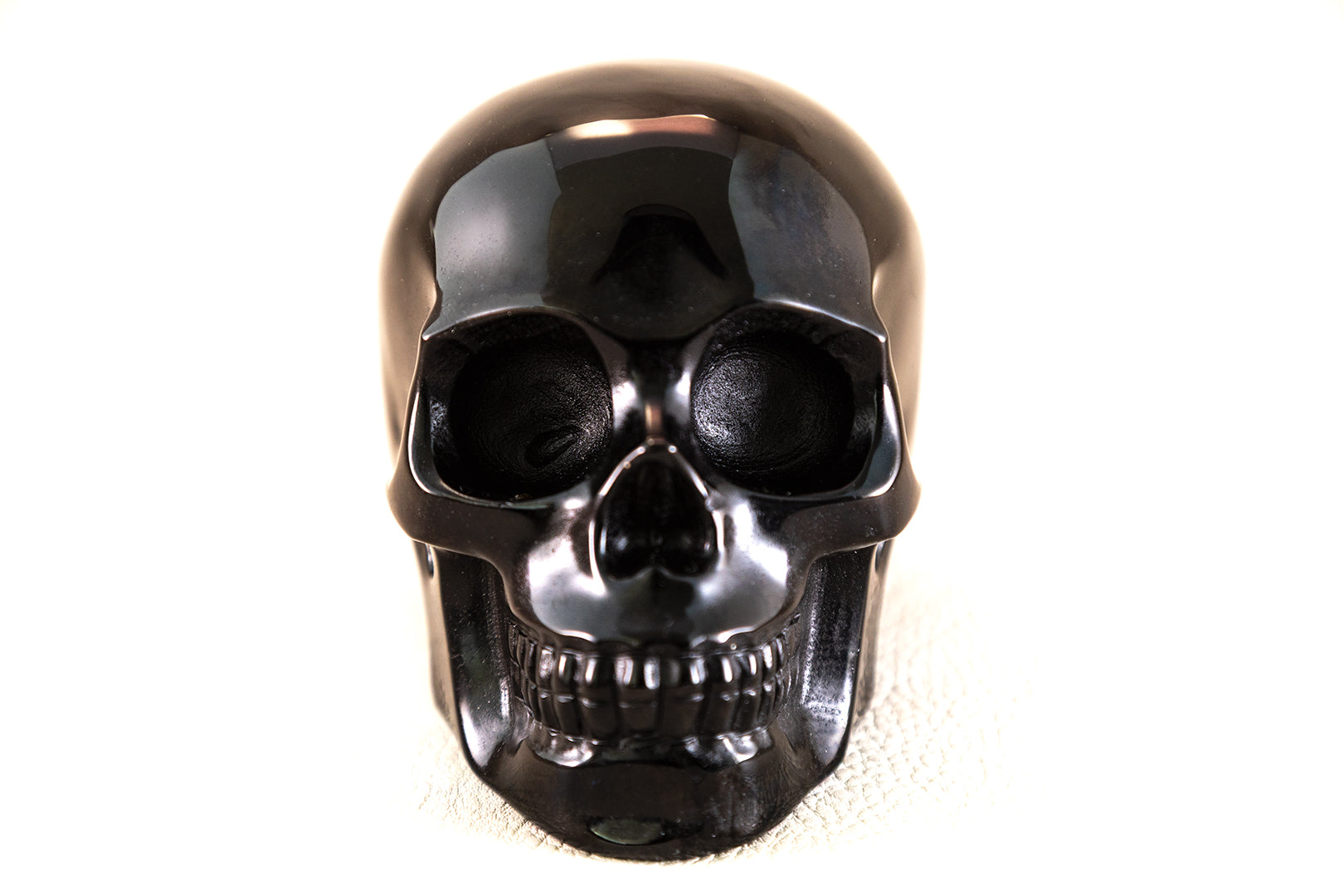 Large hand-carved black obsidian skull crystal for grounding and protection