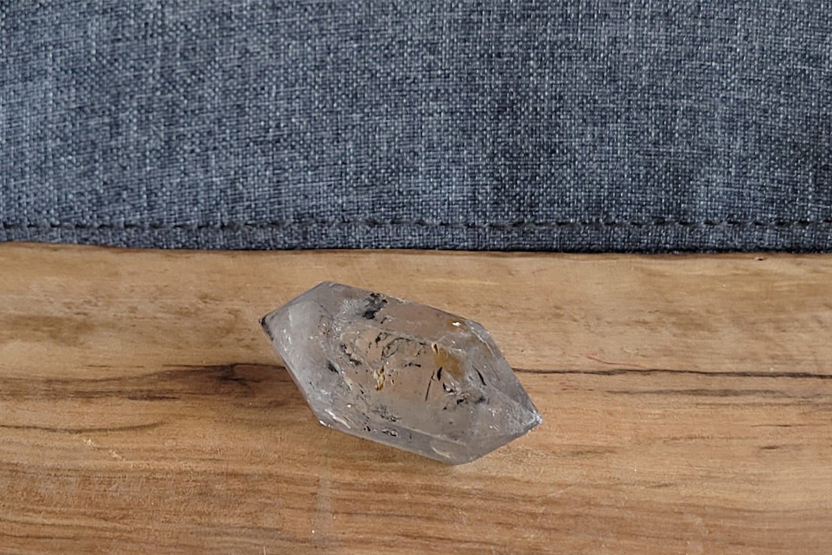 Clear quartz crystal with ancient water bubble trapped inside