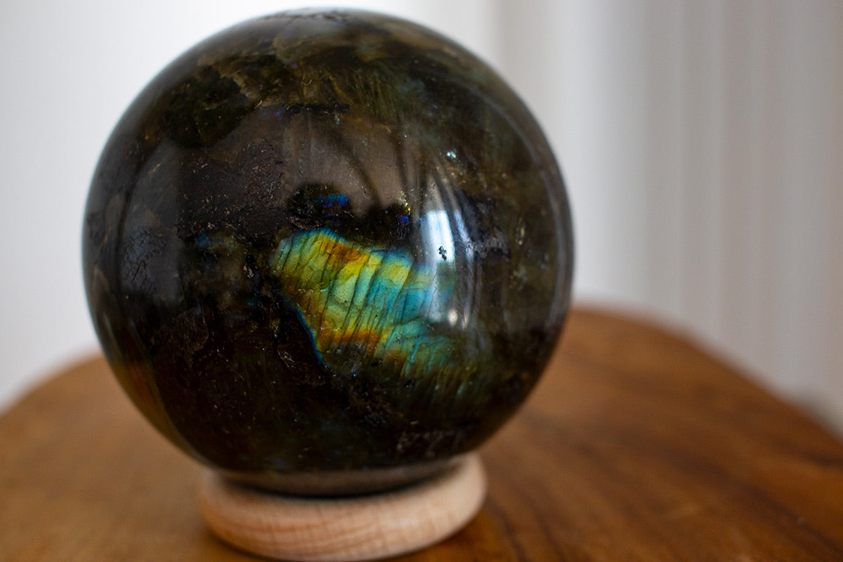 Close-up of labradorite sphere revealing natural color flashes