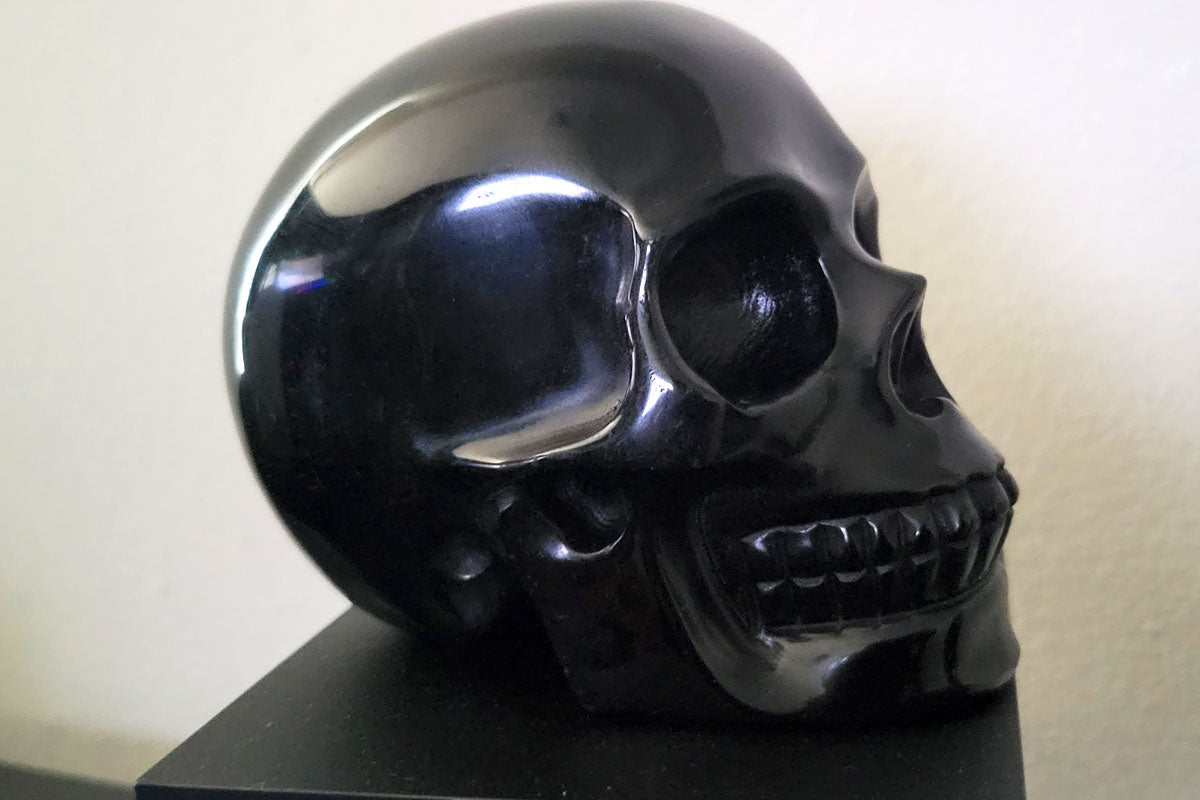 Large hand-carved black obsidian skull crystal for grounding and protection