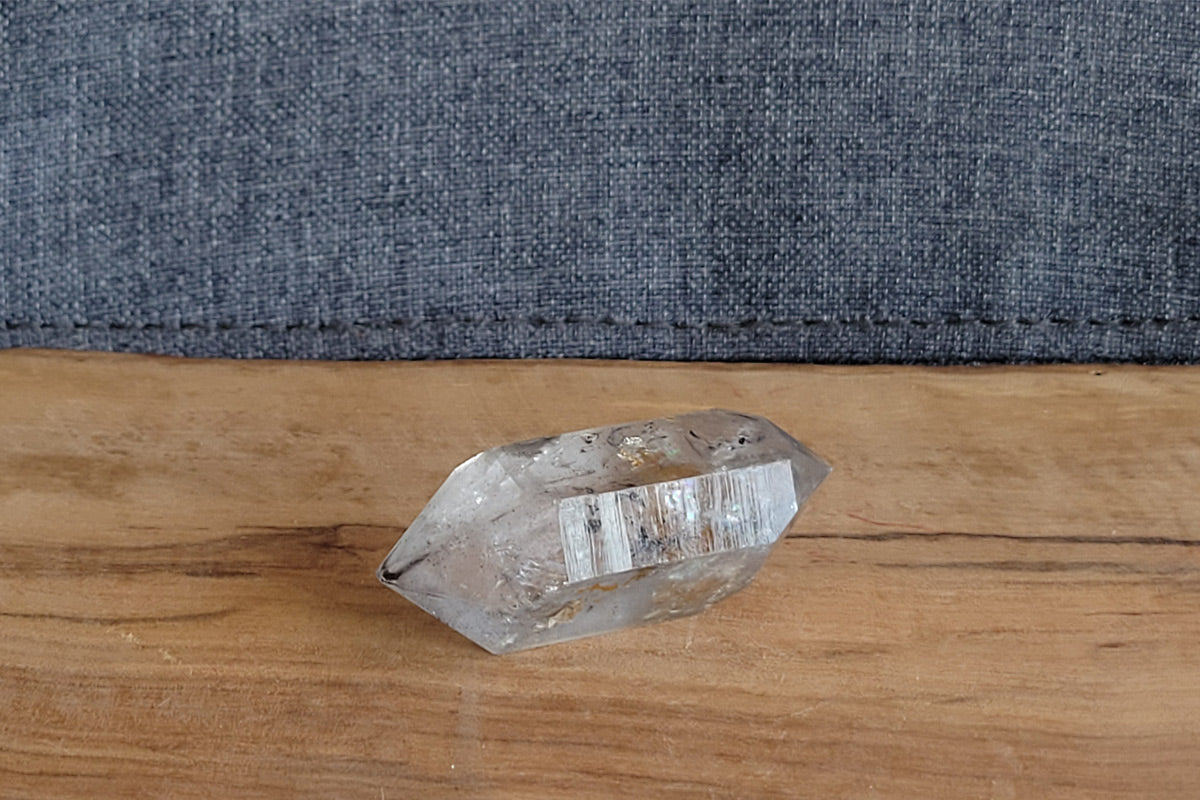 Clear quartz crystal with ancient water bubble trapped inside